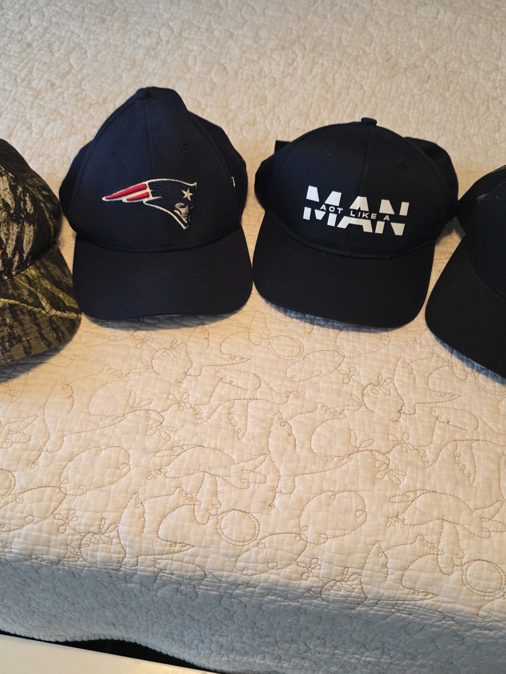 4 hats in one bundle. Camo, New England Patriots, and more